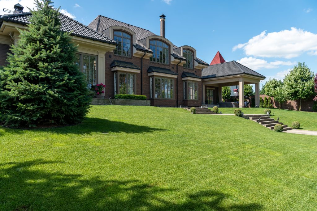 Luxury private estate with expansive lawn and landscaping